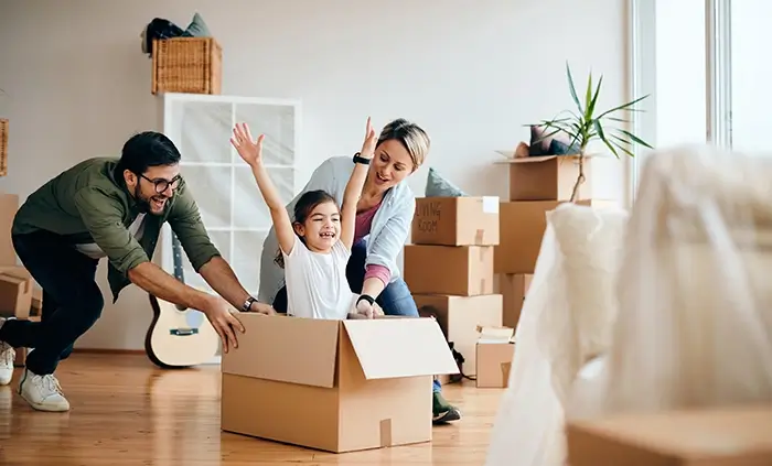 carefree-family-having-fun-while-moving-into-new-home2